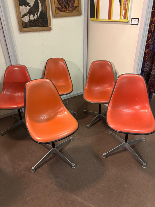 HERMAN MILLER Swivel Chairs. Orange vinyl covered